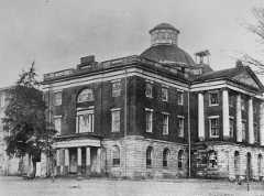 Photograph of the east and south sides of the building, during it's time as an Alabama Central Women's College building. Note the four-story tall dormitory on the left side of the image. Old Alabama State Capitol, Broad Street, Tuscaloosa, Tuscaloosa County, AL From the Library of Congress, 1880 16