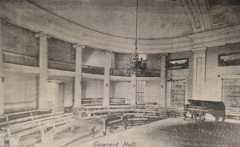 Interior concert hall from the building's time as a Woman's College, once the room of The House of Representatives. Note the ionic pillars, and the similarity to both the Classic Greek amphitheatre and the House of Representatives of the Washington DC Capitol Building. From Amalia K. Amaki's Tuscaloosa.  15