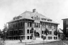 Black and white historical photo of a building on Case Western Reserve’s campus with a sign on it that says “Electricity”