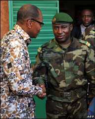 Mohamed Ibn Chambas (left) shakes hands with Col Djibrilla Hima Hamidou
