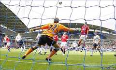 Man Utd striker Michael Owen (left) glances in a header to draw his side level at Bolton
