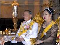 King Bhumibol with Queen Sirikit seated on thrones