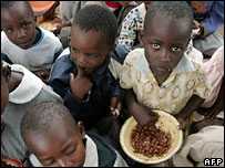 Zimbabwe school children with bowls of food