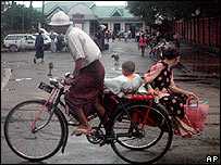 Residents go on their daily business on Monday Oct.1, 2007, in Rangoon