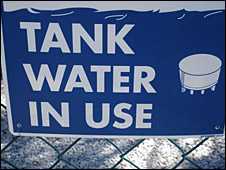 A sign showing tank water in use