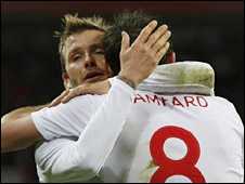 David Beckham and Frank Lampard celebrate England's third goal