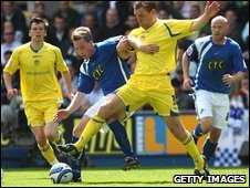 Neil Harris and Richard Naylor battle for the ball
