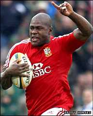 Ugo Monye celebrates after running 70m following an intercepted pass