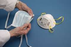 Surgical mask (L) and N95 mask (R)