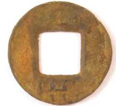 Wu zhu coin with          Chinese character "wang" on reverse