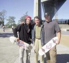 (L. to r.) Clint, former Community Board 1 District Manager George Delis and Dan pose in the new skate park in Astoria Park under the approach to the Robert F. Kennedy Bridge. Clint and Dan traveled from New Jersey to try their skateboards on the park’s cement surface.