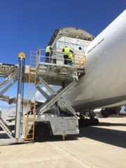 The Jason 3 satellite is offloaded from a Boeing 747F transport plane at Vandenberg Air Force Base on Thursday. Credit: NASA/Mark Mertz