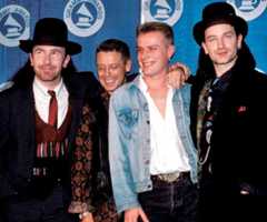 Left to right: U2's The Edge, Adam Clayton, Larry Mullen Jr. and Bono attend the 1988 Grammy Awards.