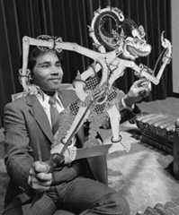 Mr Widiyanto holds a Javanese shadow puppet