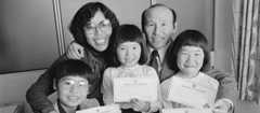 A Korean family with their certificates of citizenship