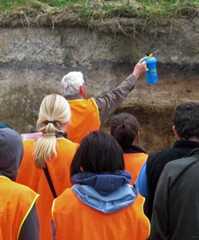 Students examine a soil profile