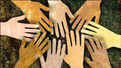 Image of different skin tone hands in a high-five circle