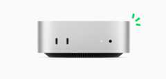 Front view of silver Mac mini showing front ports and indicator light, with carbon neutral story illustrated by small green accents.