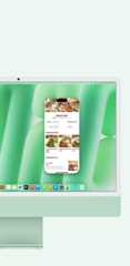 A green iMac demonstrating the use of iPhone Mirroring and the Messages app on screen.