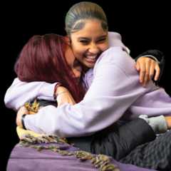 Friends have a hug on a beanbag chair