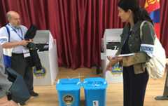 Two EU election observers at the polling station