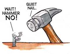 Hammer preparing to pound in a screw.