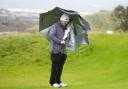 Robert MacIntyre shelters from the storm during day two of the Dunhill Links Championship