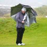 Robert MacIntyre shelters from the storm during day two of the Dunhill Links Championship