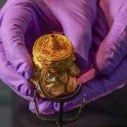 Curator Craig Angus from National Museums Scotland puts finishing touches to the installation of the Rock Crystal Jar from the Galloway Hoard at Kirkcudbright Galleries