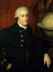 Portrait of a man wearing a wig and a military jacket with brass buttons. He has one hand in his pocket, and another resting next to a large globe. There is a red curtain behind him, and a small shelf of books. 