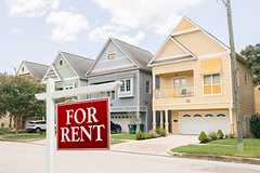 House with a For Rent Sign in Front
