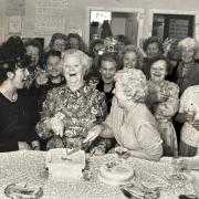 The Mayor of Burnley, Councillor Irene Cooney and mangageress Kath Raiostrick cut the second birthday cake of the Imperial Cancer Research Fund shop in Burnley in 1991 watched by regional shop organiser Karen Lawson, left, and volunteers