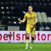 Blackburn Rovers' Lewis Miller celebrates with the fans at the end of the match.