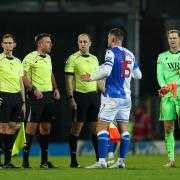 Sean McLoughlin speaking with the officials