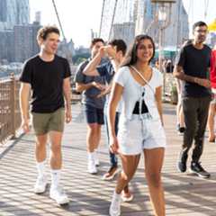 students walking across brooklyn bridge