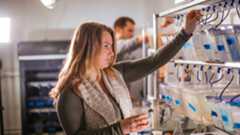 student using lab equipment