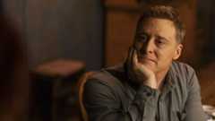 Harry Vanderspeigle (Alan Tudyk) rests his head in his hand on Resident Alien Episode 406.