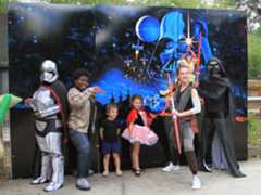 characters posing with kids