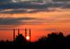 Turkmenistan - Ashghabat: minarets at sunset - Süleyman Demirel Mosque - silhouette - red sky - photo by G.Karamyanc