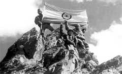 Victorious Indian soldiers pose atop the formidable Tiger Hill during the Kargil War.