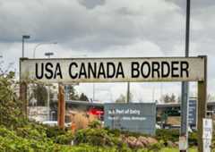 Surrey, British Columbia: BNRR Railway USA Canada border sign. Editorial credit: illuminaphoto / Shutterstock.com
