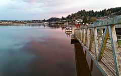 Boat dock at sundown on the Willapa River at South Bend, Washington.