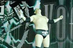 Michael Cole models Triple H's ring attire on Raw SuperShow