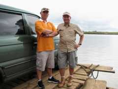 A RACER AND A BIRDER. My brother Jeff (left) ably piloted our birding vehicle, as he made the over 500 km trip to Malasi Lake in just under 10 hours, including wading through heavy traffic along the way. Here, Jeff and birding buddy Neon pose by our car while we cross the mighty Cagayan river aboard a makeshift raft.