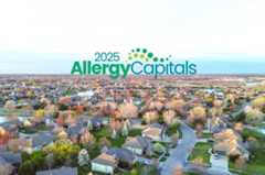 A woman standing in front of a fan