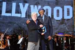 "Star Wars" creator George Lucas inducts Samuel L. Jackson, the world's top-grossing film star, into the Academy.