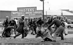 State troopers use clubs against participants of a civil rights voting march in Selma, Alabama, March 7, 1965. At foreground right is John Lewis, Chairman of the Student Nonviolent Coordinating Committee, who is beaten by a state trooper. The day, which became known as "Bloody Sunday," is widely credited for galvanizing the nation's leaders and ultimately yielding passage of the Voting Rights Act of 1965. (AP Photo/File)