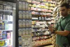 Vita Coco employee working on mobile