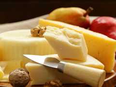 Cheese on a board with fruit