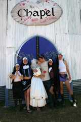 Festival-goers in fancy dress at the Chapel of Love and Loathing